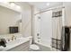 Well-lit bathroom features a shower-tub combo, a vanity with a sink, and modern finishes at 13218 W Crimson Ter, Peoria, AZ 85383