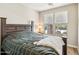 Cozy bedroom with natural light, a comfortable bed, and a view of the outdoors at 13218 W Crimson Ter, Peoria, AZ 85383