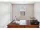 Well-lit home office with a spacious wooden desk and a view from the window at 13218 W Crimson Ter, Peoria, AZ 85383