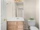 Clean, well-maintained bathroom featuring a vanity with storage and a standard toilet at 1478 E Spur Ave, Gilbert, AZ 85296