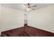 This spare bedroom features carpet, neutral walls, a ceiling fan, and a single closet at 1478 E Spur Ave, Gilbert, AZ 85296