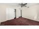 A secondary bedroom features ample closet space and neutral walls at 1478 E Spur Ave, Gilbert, AZ 85296