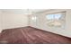 A bright bedroom features large windows offering great views at 1478 E Spur Ave, Gilbert, AZ 85296