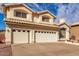 Well-maintained two-story home with a three-car garage and a clean, inviting driveway at 1478 E Spur Ave, Gilbert, AZ 85296