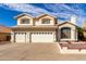 Inviting two-story home with a three-car garage and well-maintained landscaping in a suburban neighborhood at 1478 E Spur Ave, Gilbert, AZ 85296