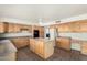 Spacious kitchen with a center island, ample cabinetry, and stainless steel appliances for a modern touch at 1478 E Spur Ave, Gilbert, AZ 85296