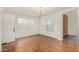 Bright living room with wood floors, large windows, and a chandelier at 1478 E Spur Ave, Gilbert, AZ 85296