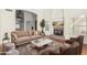 Bright living room with a high ceiling, fireplace, and a large comfortable sofa at 1478 E Spur Ave, Gilbert, AZ 85296