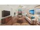 Spacious living room featuring a fireplace, ceiling fan, and neutral-toned furniture at 1478 E Spur Ave, Gilbert, AZ 85296