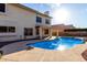 Gorgeous backyard pool and covered patio perfect for entertaining on sunny afternoons at 1478 E Spur Ave, Gilbert, AZ 85296