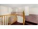 A bright staircase with wood banisters leads to the upper level at 1478 E Spur Ave, Gilbert, AZ 85296