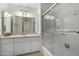 Bathroom featuring a shower with a glass door and a vanity with storage cabinets at 1500 N Markdale -- # 8, Mesa, AZ 85201