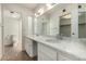 Bathroom featuring double sinks with marble countertops and a large mirror at 1500 N Markdale -- # 8, Mesa, AZ 85201
