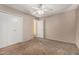 Bedroom with closet and door leading to another room. Carpeted floors and light walls at 1500 N Markdale -- # 8, Mesa, AZ 85201