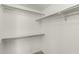 Walk-in closet featuring built-in shelving and clothing rods for ample storage at 1500 N Markdale -- # 8, Mesa, AZ 85201