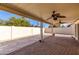 Spacious covered patio featuring pavers, a ceiling fan, and a view of desert landscaping at 1500 N Markdale -- # 8, Mesa, AZ 85201