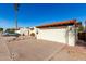 Lovely single-story home showcasing a well-maintained driveway and red tile roofing at 1500 N Markdale -- # 8, Mesa, AZ 85201