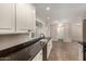 Bright kitchen with granite countertops, white cabinets, and stainless steel appliances at 1500 N Markdale -- # 8, Mesa, AZ 85201