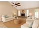 Cozy living room with fireplace, vaulted ceiling, and comfortable neutral-toned furniture at 1500 N Markdale -- # 8, Mesa, AZ 85201