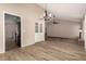 Spacious layout with wood floors, a ceiling fan, and access to the kitchen at 1500 N Markdale -- # 8, Mesa, AZ 85201