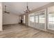 Open-concept living room with wood floors, a fireplace, and access to the outdoor patio at 1500 N Markdale -- # 8, Mesa, AZ 85201