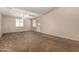 Spacious living room with neutral carpet, a ceiling fan, and a front entry door at 1500 N Markdale -- # 8, Mesa, AZ 85201