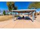 Relaxing covered picnic spot with multiple tables and BBQ, perfect for gatherings in a scenic, park-like community setting at 1500 N Markdale -- # 8, Mesa, AZ 85201