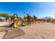 Fun playground with multiple play structures and slides, providing a safe and engaging area for children to play and explore at 1500 N Markdale -- # 8, Mesa, AZ 85201