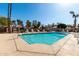 Community pool featuring clear water, plenty of seating, and lush desert landscaping at 1500 N Markdale -- # 8, Mesa, AZ 85201
