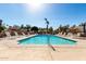 A refreshing community pool with plenty of room for seating, and a sunny sky at 1500 N Markdale -- # 8, Mesa, AZ 85201