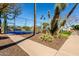View of well-maintained tennis courts surrounded by desert landscaping and palm trees at 1500 N Markdale -- # 8, Mesa, AZ 85201