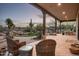 Spacious covered patio with desert views and relaxing seating areas at 15123 E Monument Rd, Scottsdale, AZ 85262