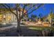 Backyard with a cozy fire pit, patio seating, and desert landscaping at 15123 E Monument Rd, Scottsdale, AZ 85262