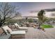 Resort-style backyard with lounge chairs, rock waterfall, and desert landscaping at 15123 E Monument Rd, Scottsdale, AZ 85262