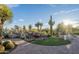 Serene backyard oasis features a rock waterfall, lush landscaping, and a desert backdrop at 15123 E Monument Rd, Scottsdale, AZ 85262