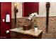 Elegant bathroom with granite countertops, copper sink, and designer lighting at 15123 E Monument Rd, Scottsdale, AZ 85262