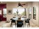 Cozy breakfast nook with a view of the landscaped backyard with desert landscaping at 15123 E Monument Rd, Scottsdale, AZ 85262
