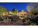 Charming home with stone accents, desert landscaping, and inviting pathway at 15123 E Monument Rd, Scottsdale, AZ 85262