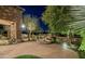 Expansive front yard showcasing a stone fountain and lush desert landscaping at 15123 E Monument Rd, Scottsdale, AZ 85262