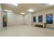 Spacious garage with ample storage cabinets and a work bench at 15123 E Monument Rd, Scottsdale, AZ 85262
