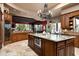 Spacious kitchen island with granite countertop and stainless steel microwave at 15123 E Monument Rd, Scottsdale, AZ 85262