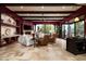 Spacious living room with travertine flooring, comfortable seating, ceiling fan and fireplace at 15123 E Monument Rd, Scottsdale, AZ 85262