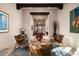 Well-lit living room with designer rug and view to entry at 15123 E Monument Rd, Scottsdale, AZ 85262