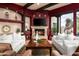 Cozy living room with stone fireplace, recessed lighting, comfortable seating, and a large picture window at 15123 E Monument Rd, Scottsdale, AZ 85262