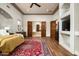 Bright main bedroom with hardwood floors, open bath, and walk-in closet at 15123 E Monument Rd, Scottsdale, AZ 85262