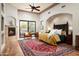 Spacious main bedroom with fireplace, hardwood floors, and sliding glass doors at 15123 E Monument Rd, Scottsdale, AZ 85262