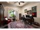 Home office with custom rug, desk and built-in shelving at 15123 E Monument Rd, Scottsdale, AZ 85262