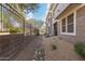 Exterior view of the townhome with a rock garden and desert landscaping at 15221 N Clubgate Dr # 1088, Scottsdale, AZ 85254