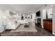 Bright living room with a white sectional sofa, fireplace, and a contemporary glass coffee table at 15221 N Clubgate Dr # 1088, Scottsdale, AZ 85254