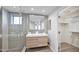 Contemporary bathroom with a double vanity, tiled shower, and a walk-in closet at 15221 N Clubgate Dr # 2094, Scottsdale, AZ 85254